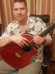 Педагог по вокалу, преподаватель по игре на гитаре Александр Игоревич Савин